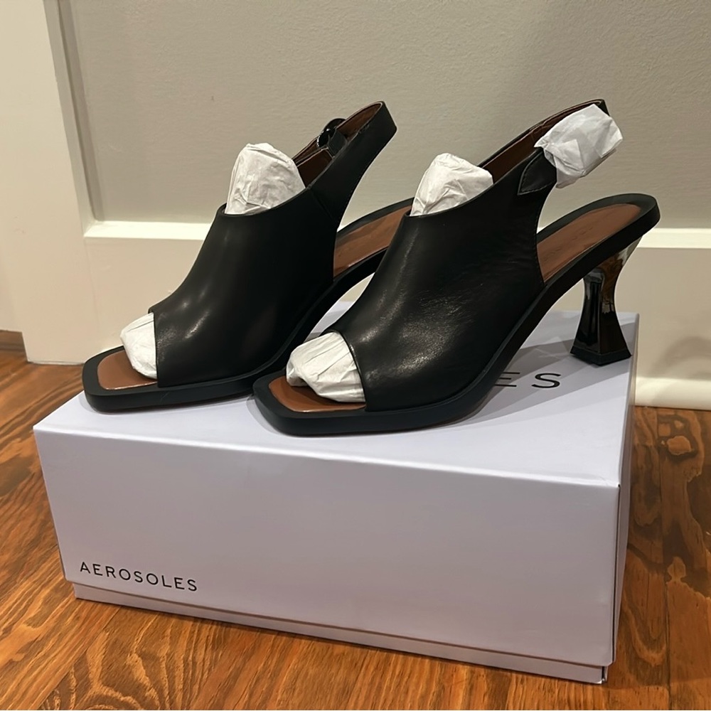 Aerosols NWT, size 9, black leather , back strap heels.
